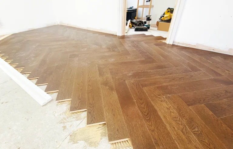 Herringbone oak flooring being installed in the Great Bowden loft conversion