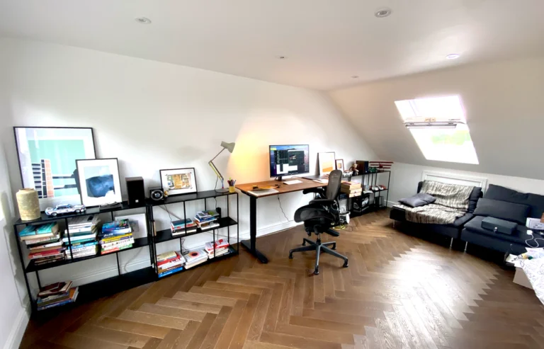 Great Bowden loft home office with rooflight, herringbone oak flooring and seating