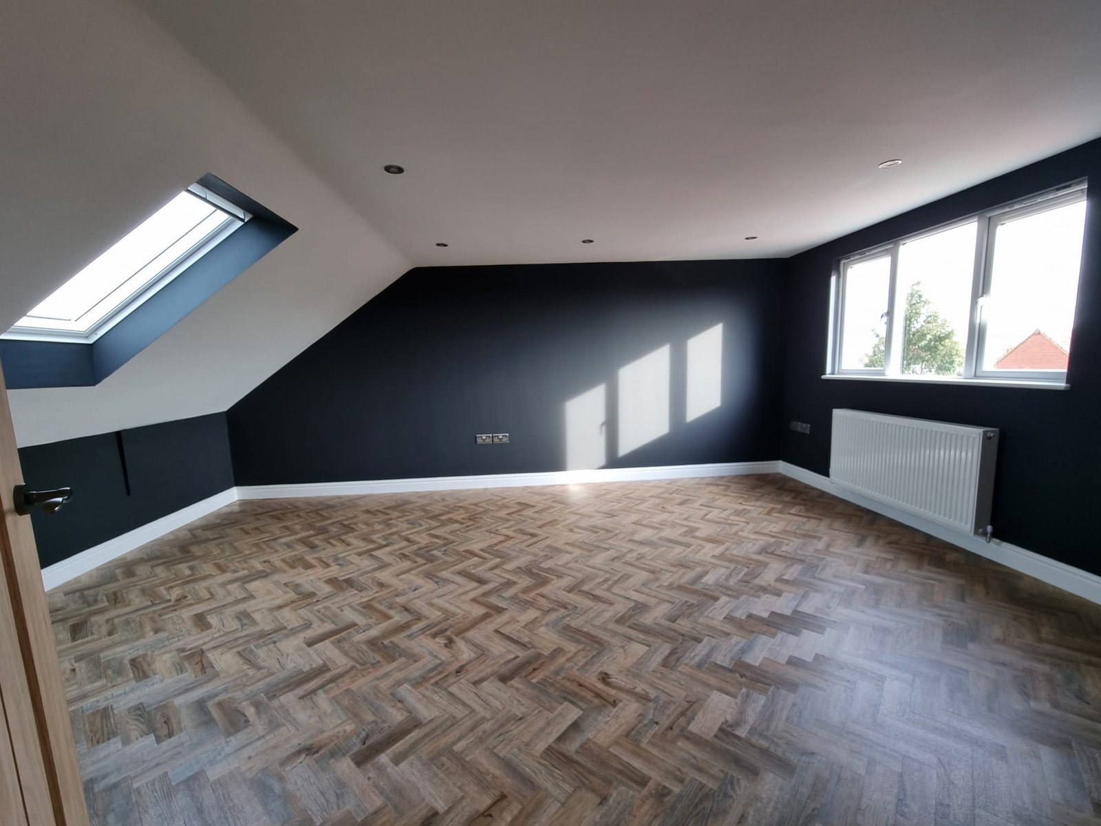 Finished Desborough loft room with a large rooflight